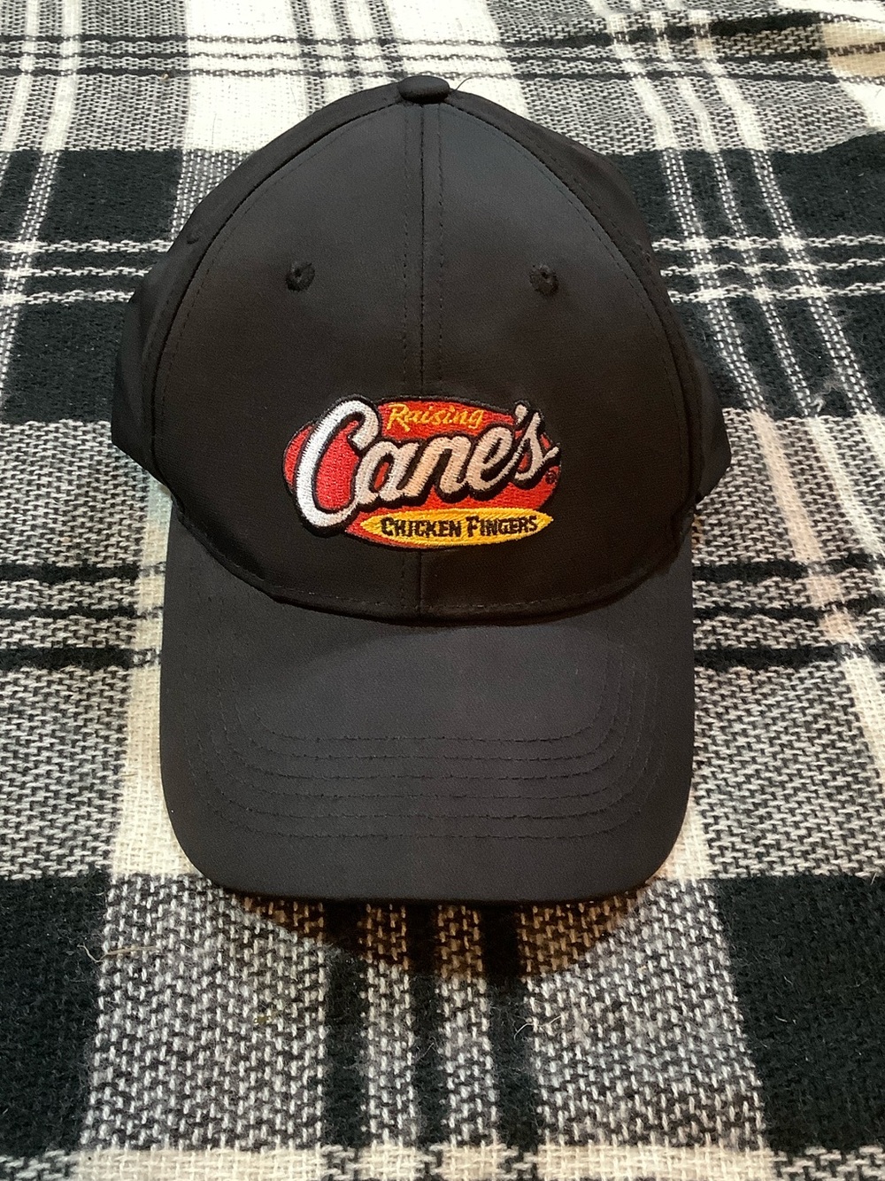 Raising cane’s black baseball cap